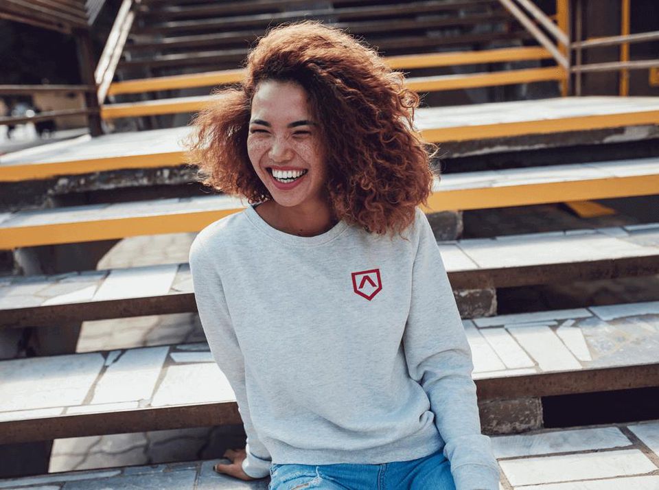 Girl in Lambda T-Shirt stting on steps